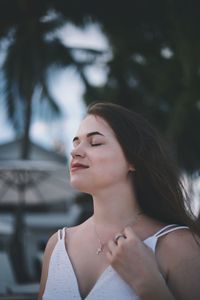 Portrait of a young woman looking away