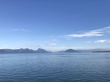 Scenic view of sea against blue sky