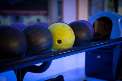 Close-up of fruits and balls on table