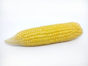 Close-up of yellow cake against white background