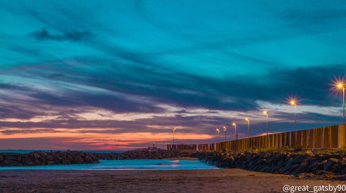 Scenic view of sea against sky at sunset