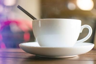 Close-up of coffee cup on table