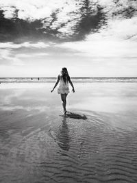 Woman standing on beach