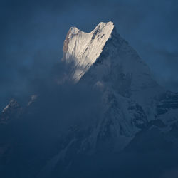 Snowcapped landscape against sky