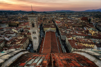 High angle view of city at sunset