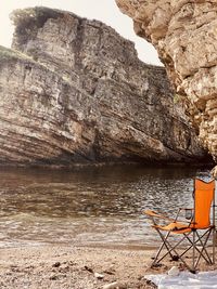 Scenic view of sea against rock formation