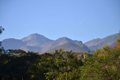 Scenic view of mountains against clear blue sky