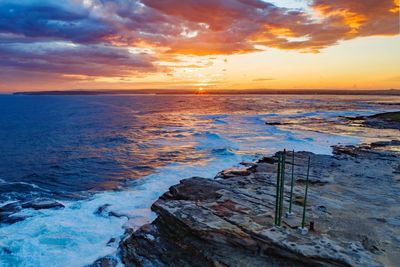 Scenic view of sea against sky during sunset