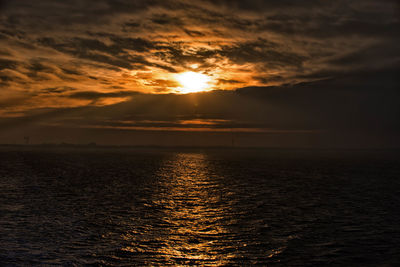 Scenic view of sea against sky at sunset