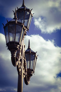 Low angle view of street light against sky