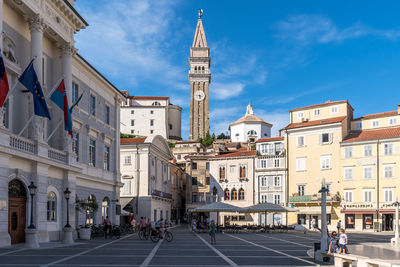 Buildings in city against sky