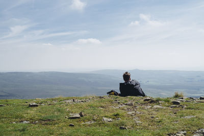 Rear view of man looking at mountain view