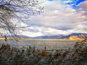 Scenic view of lake against sky during winter