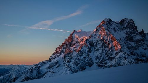 Snow covered mountain against sky