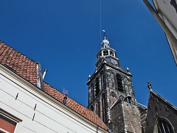 Low angle view of temple against clear blue sky