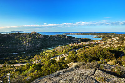 Scenic view of landscape against blue sky