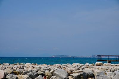 Scenic view of sea against clear blue sky