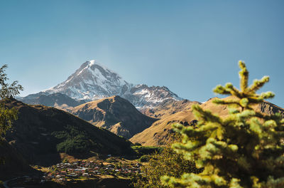 View of mount kazbek and the village of stepantsminda, georgia