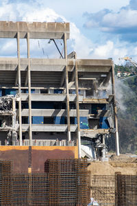 Low angle view of construction site against sky