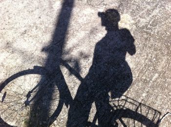 Shadow of man on zebra crossing