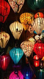 Low angle view of illuminated lanterns hanging in market