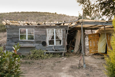 Abandoned house on field