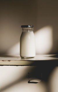 Close-up of milk in bottle on table
