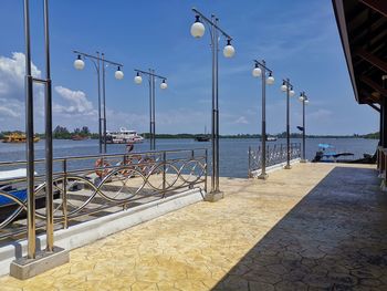 Street by sea against sky