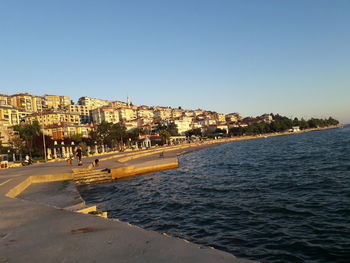 View of town against clear blue sky