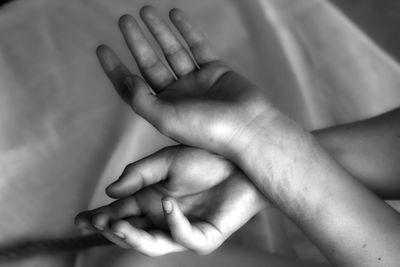 Cropped image of hands with marks