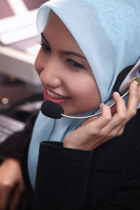 Female customer service representative working in office