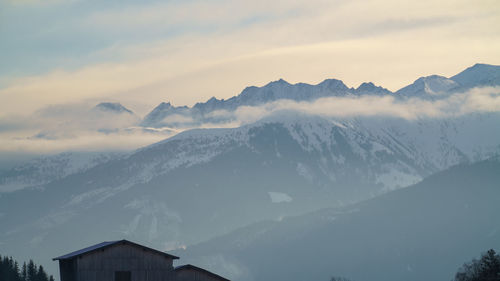 Scenic view of snowcapped mountains against sky