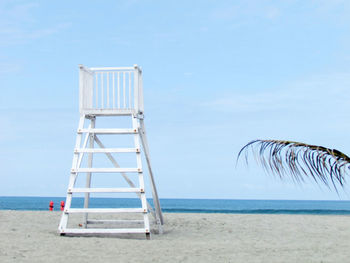 Lifeguard hut on beach against clear sky