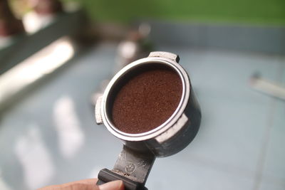 Close-up of hand holding coffee