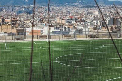 Close-up of soccer field in city