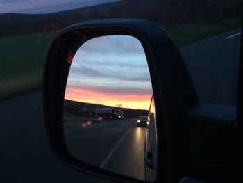 Sunset seen through car windshield