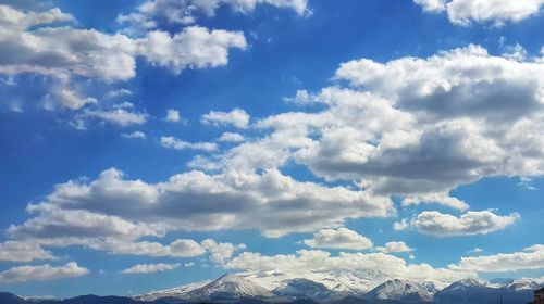 Low angle view of clouds against blue sky