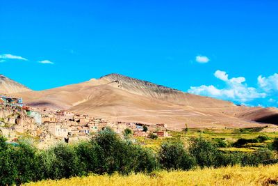 View of landscape against blue sky