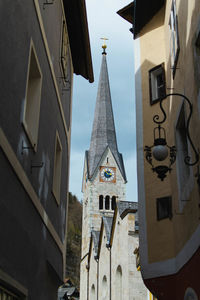 Low angle view of buildings in city against sky