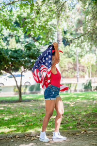 Low section of woman standing in park