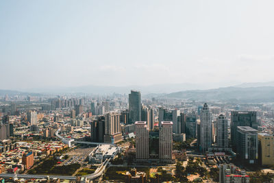 High angle view of modern buildings in city against sky