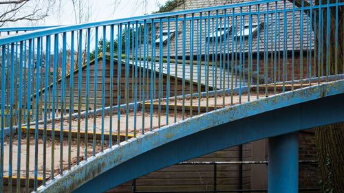 Low angle view of bridge by building