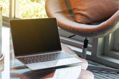 Close-up of laptop on table at home