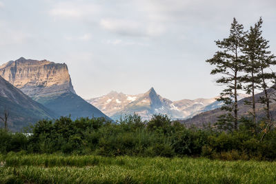 Scenic view of mountains against cloudy sky