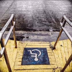 High angle view of sign on parking lot