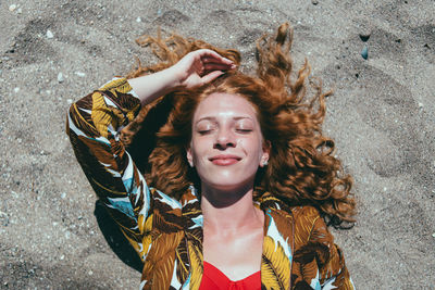 Portrait of young woman lying down