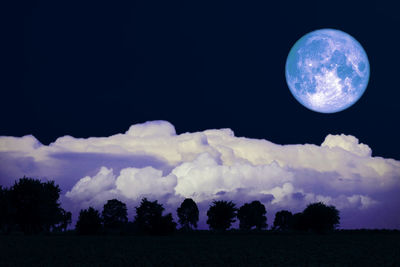 Scenic view of field against sky at night