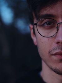 Close-up of young man wearing eyeglasses