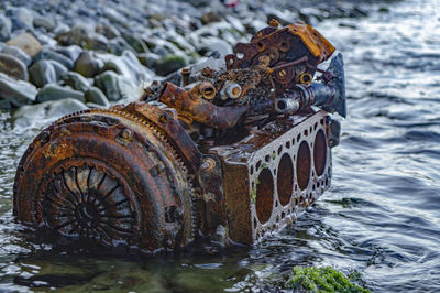 Close-up rusty the internal combustion engine in the water