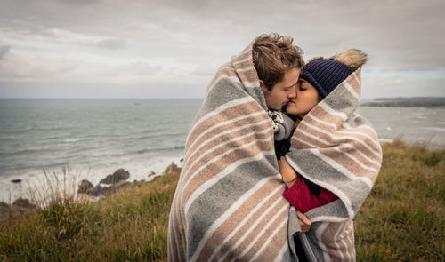 Young couple kissing on beach